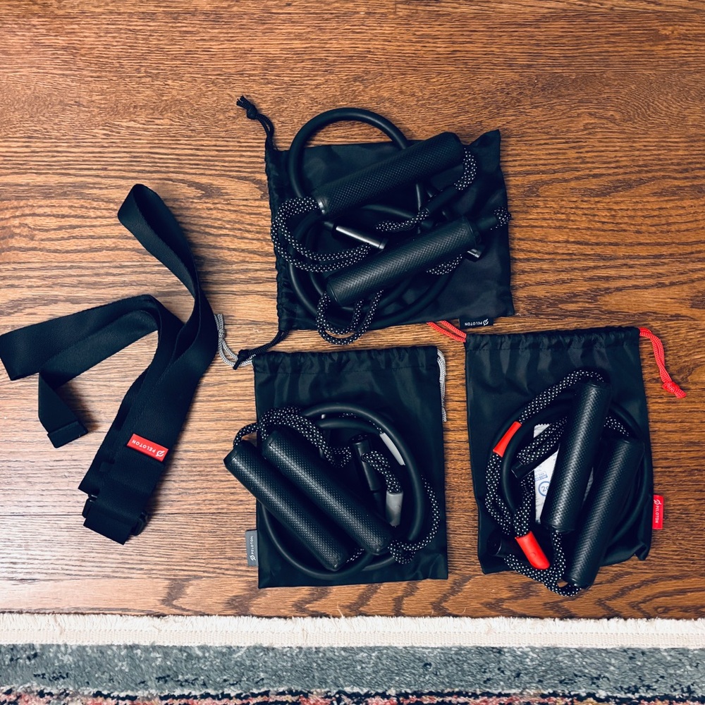 Never Used Peloton brand resistance bands and yoga strap. Perfect condition.